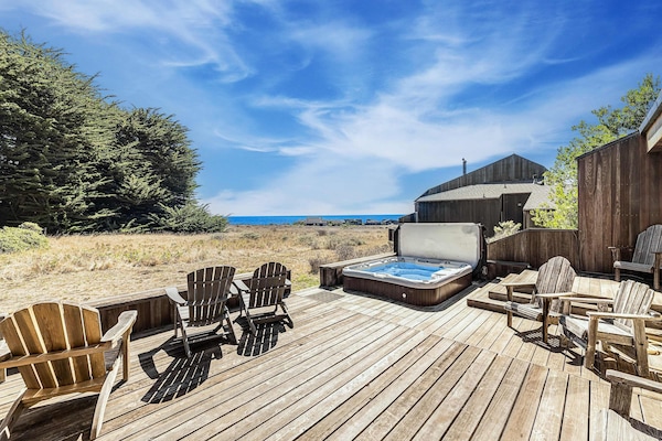 Soak in your private hot tub while gazing at the endless ocean view—perfect for unwinding after a day of adventure.