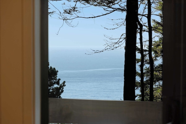 Gaze out at the breathtaking ocean view from this cozy nook, where every moment invites you to relax and soak in the beauty of nature.