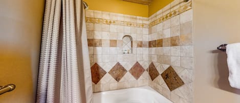 Shower, hair dryer, towels, shampoo