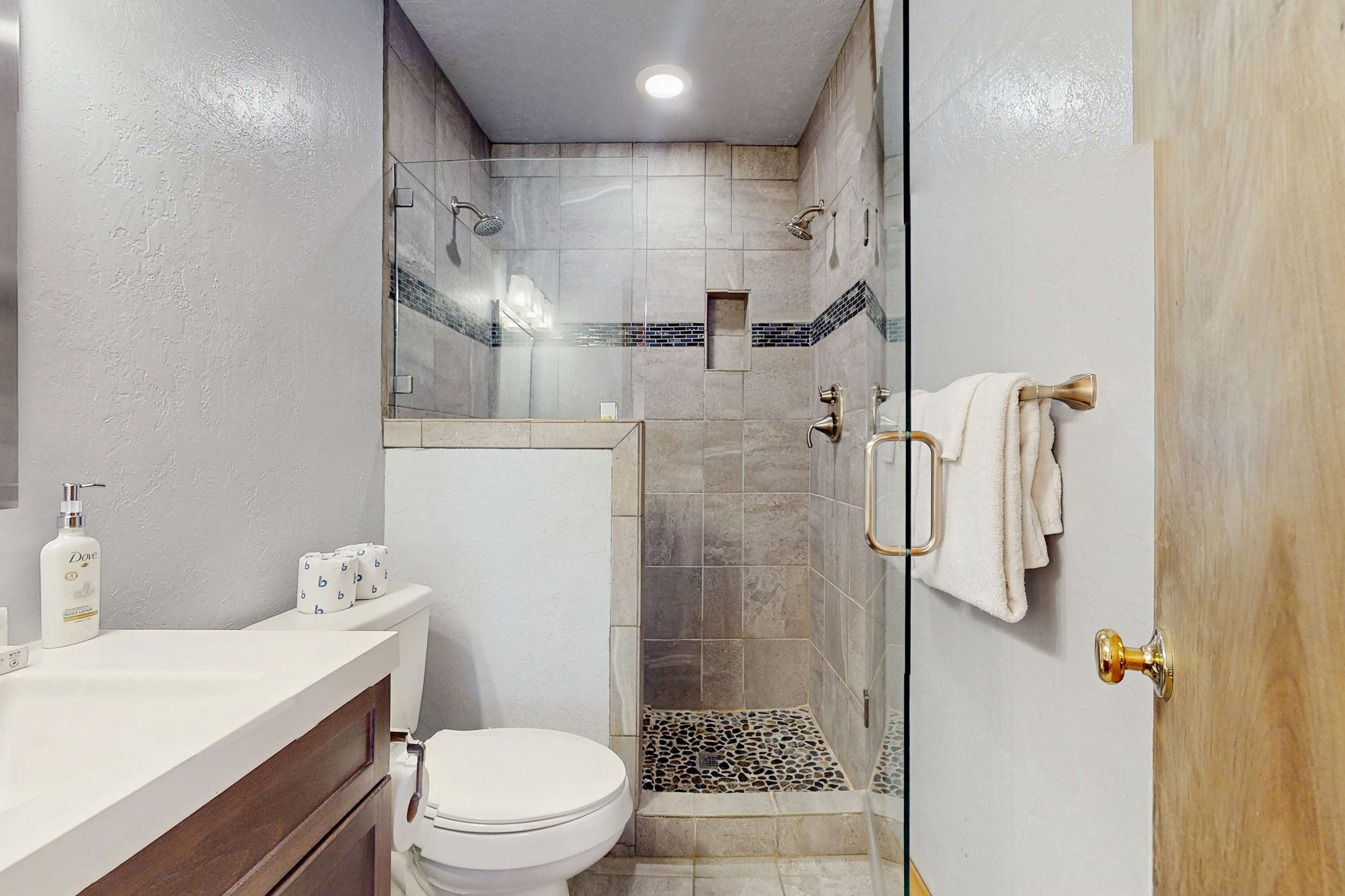 Shower, hair dryer, towels, shampoo
