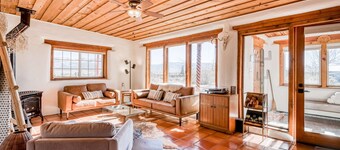 Colorful dog-friendly home with sweeping views, a private hot tub, & large yard