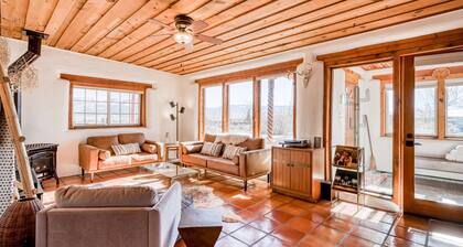 Colorful dog-friendly home with sweeping views, a private hot tub, & large yard