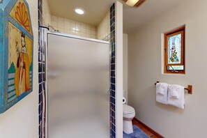 Shower, hair dryer, towels, shampoo
