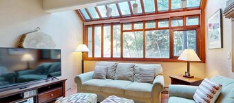 Designer Forest-View Condo with Balcony, Wood Stove & Sunroom - Near Slopes