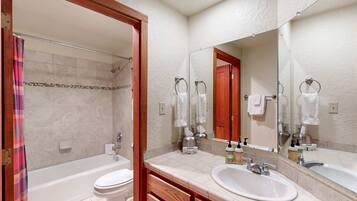 Shower, hair dryer, towels, shampoo