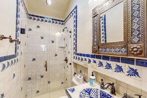 Shower, hair dryer, towels, shampoo