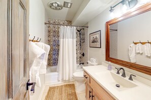 Shower, hair dryer, towels, shampoo