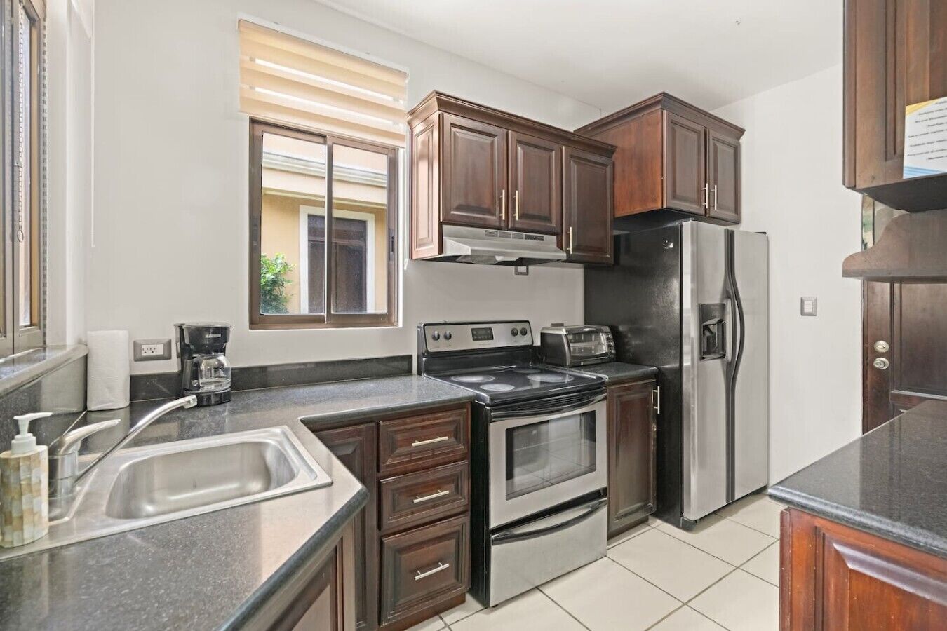 Coffee/tea maker, fridge, microwave, oven