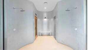 A narrow, tiled bathroom with a bench, a shower, and a door. - 3 Bedroom CBD Apartment with Pool, Gym & Spa with Gorgeous City Views (Melbourne)