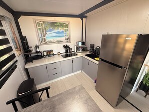 Private kitchen - Beautiful 2-Bedroom modular home in the tranquil country side of Jobos Isabela. (Isabela)