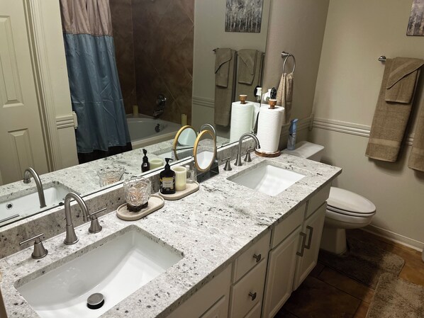 Jetted bath, hair dryer, towels, soap