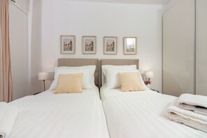 Apartamento superior | Caja fuerte, cortinas opacas, tabla de planchar con plancha