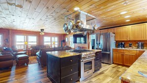 A spacious kitchen with wooden cabinets, a central island, and stainless steel appliances. - Pamoola Lodge - Waterfront| sleeps 11+|Private Dock (Rockwood)
