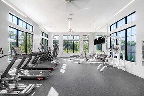 A modern gym with treadmills, weight machines, and dumbbells. - Landing | Amazing 1BD, Gym, Clubhouse (Austin)