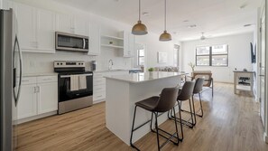 Fridge, dining tables - Landing | Modern 2BD, Gym, Clubhouse (Austin)