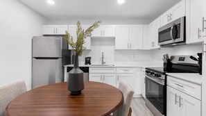 Fridge, dining tables - Landing | Chic 1BD, Gym, Pool (Kissimmee)