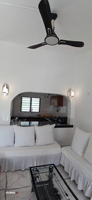 Comfort Apartment | Living area | 24-inch Smart TV with digital channels - Kigotho Hotel & Apartments (Mombasa)