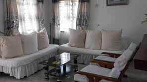 Comfort Apartment | Living area | 24-inch Smart TV with digital channels - Kigotho Hotel & Apartments (Mombasa)