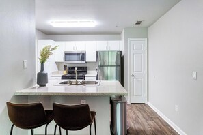 Fridge, dining tables - Landing | Incredible 2BD, Game Room, Gym (Tallahassee)
