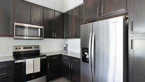 Fridge, dining tables - Landing | Chic 1BD, Gym (Conroe)