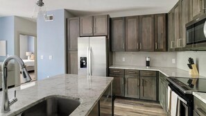 Fridge, dining tables - Landing | Spectacular 2BD, Gym (New Caney)