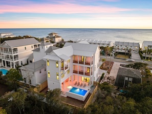 A coastal hotel with multiple buildings, a swimming pool, and a view of the ocean. - Sleeps 22! Private Pool, LSV/Golf Cart, & GULF VIEWS! Steps to Beach! (Santa Rosa Beach)