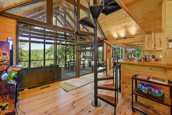 Beautiful wall of windows to enjoy the view from the kitchen, dining, and porch!