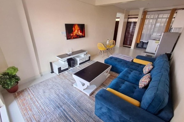 Deluxe Apartment | Living area | 32-inch Smart TV with digital channels