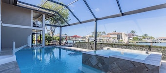 Waterfront Luxury: Spacious 7-Bed, Heated Pool and Spa Retreat