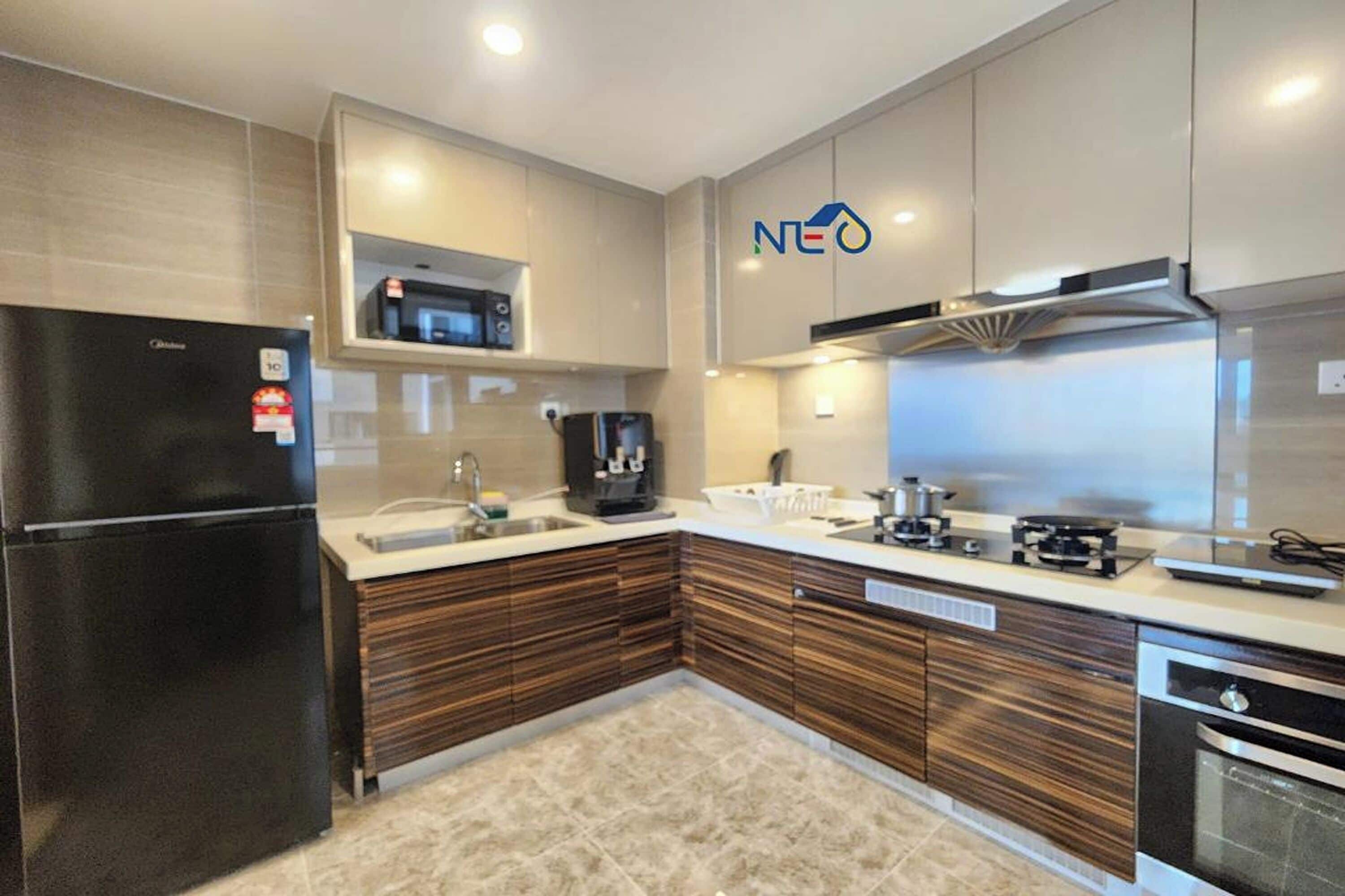 A modern kitchen with a built-in microwave, coffee maker, and oven.