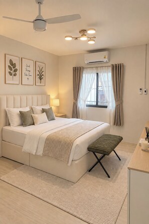 A modern bedroom with a bed, bedside tables, a desk, and an air conditioning unit. - Dad N Mom'S House By Thongnak Apartment (Pattaya)