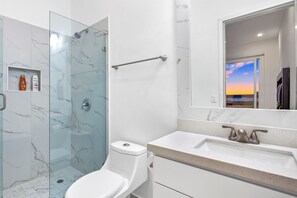 Shower, hair dryer, towels - Modern beauty with partial ocean view, open concept, & pool- dog-friendly (Rosarito)