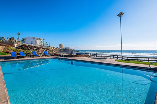 Dog-friendly ocean-view villa with patio, outdoor pool, streaming, partial AC