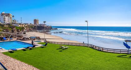 Cheerful dog-friendly villa with beach views, outdoor pool, private patio, & AC
