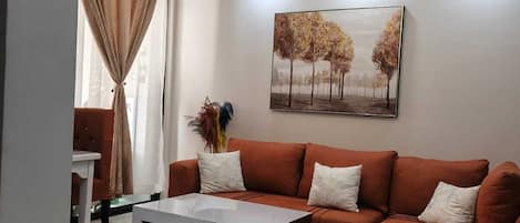 Business Apartment, City View | Living area | 32-inch Smart TV with digital channels
