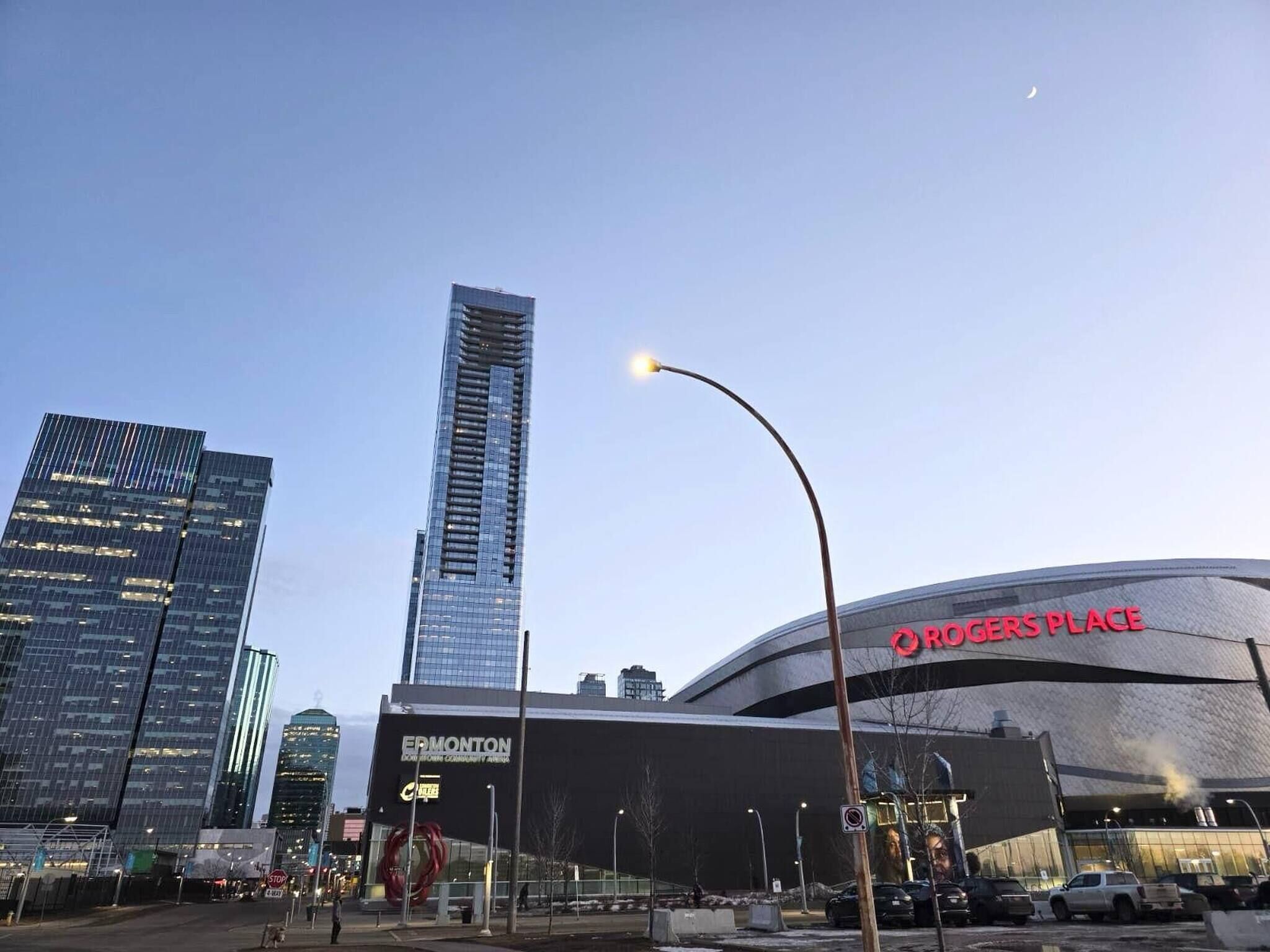 A modern building with a curved facade and a sign reading 'ORCHERS PLACE'.