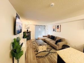 Apartment, 2 Bedrooms, Accessible, Fireplace | Living room - Modern Comfort in Edmonton's Heart, 2 Bedroom Apartment (Edmonton)