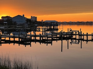 A waterfront property with dock structures and buildings. - A 11 Sundown Condominiums (Pensacola)