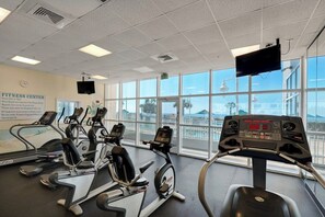 A fitness center with treadmills, an elliptical, and a stationary bike. - Majestic Sun — Gulf Views, Heated Pool + Hot Tubs (Miramar Beach)
