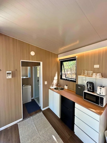 Fridge, microwave, stovetop, electric kettle. The Nest at Novena Pines by Tiny Away