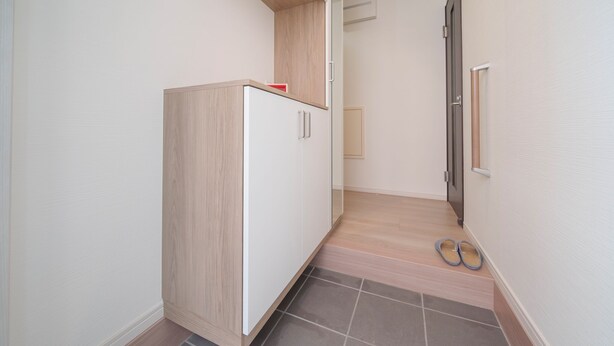 A narrow hallway with a wooden cabinet, a pair of slippers on the floor, and a door with a handle. - 【5BR Luxury Living】 130㎡DesignerHouse-5BR Luxury Living, Family Roppongi Akasaka (Tokyo)