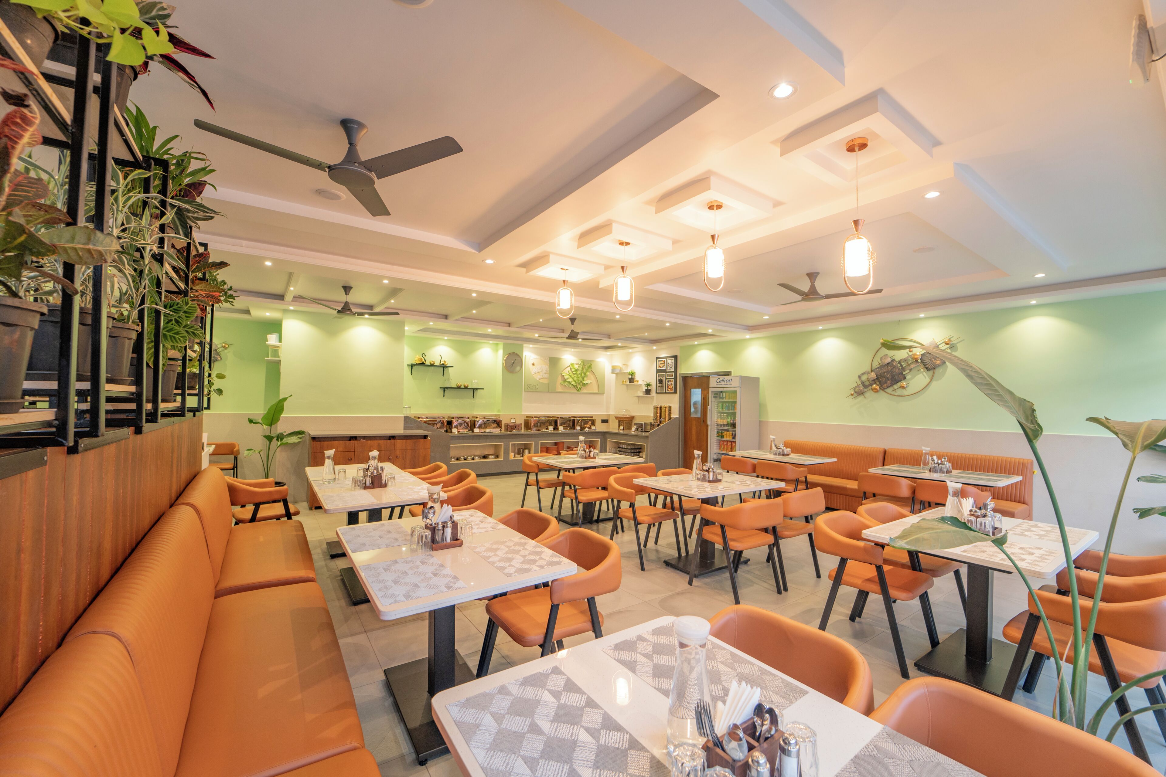 A restaurant with booths, tables, and a bar area.