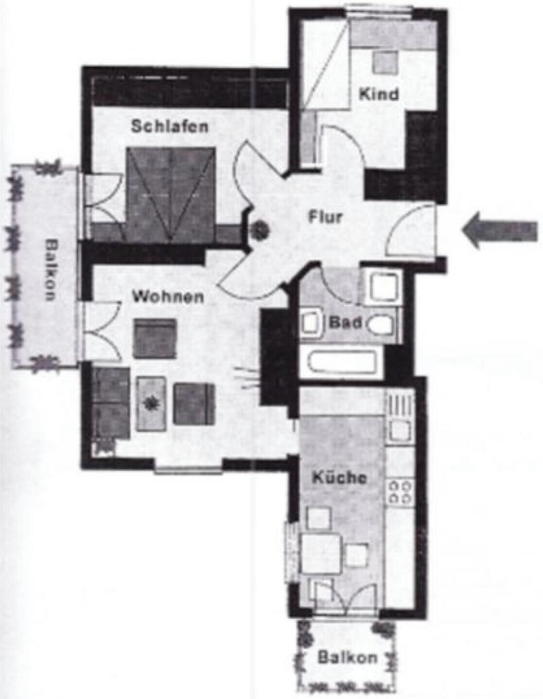 A floor plan with a living room, kitchen, bathroom, and balcony.