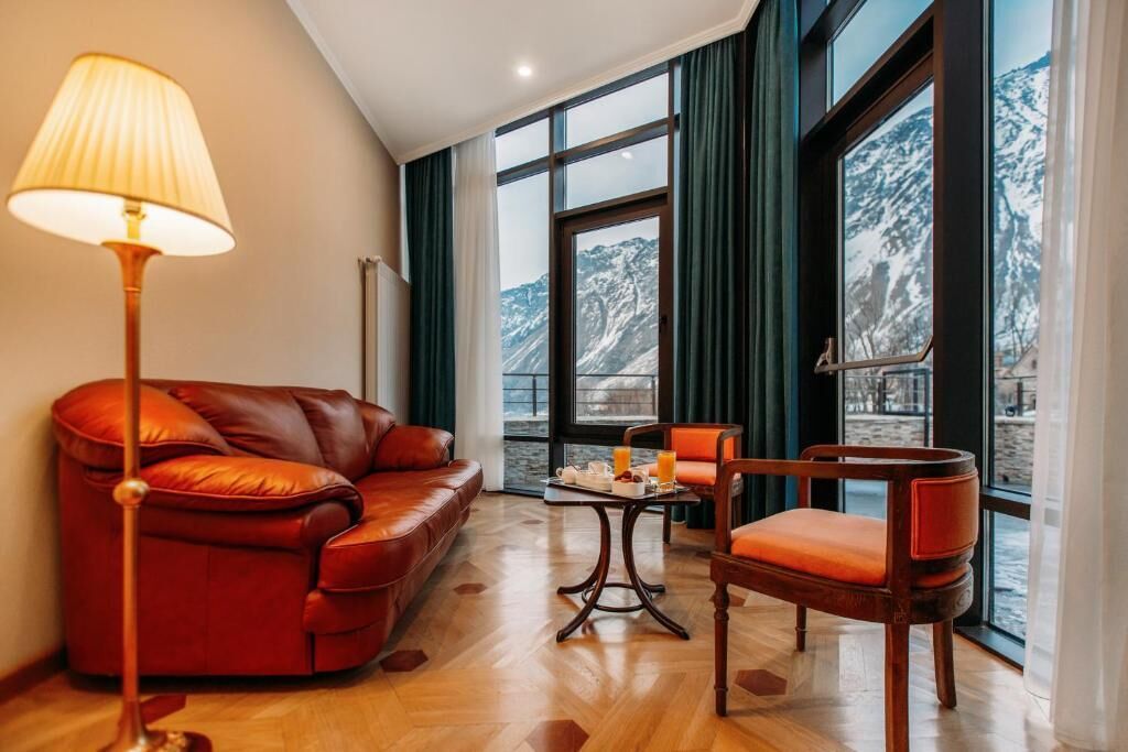 Suíte júnior, sacada, vista para a cidade | Área de estar