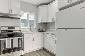 Fridge, stovetop, coffee/tea maker, cookware/dishes/utensils