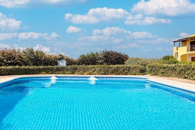 Holiday home with air conditioning and shared pool