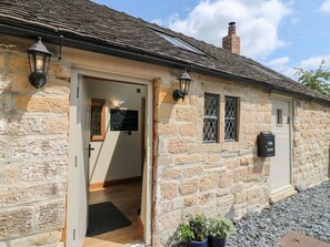 A stone building with a door, windows, and a mailbox. - 33 Main Road Higham Derbyshire (Alfreton)
