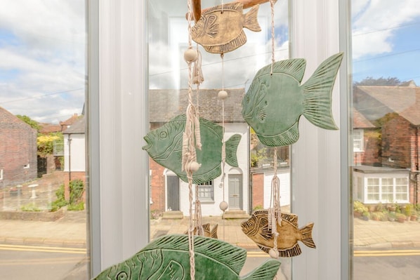 A window with hanging fish decorations. - RYE HOUSE: Central Location & WiFi (Rye)