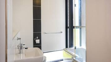 Shower, hair dryer, towels, soap