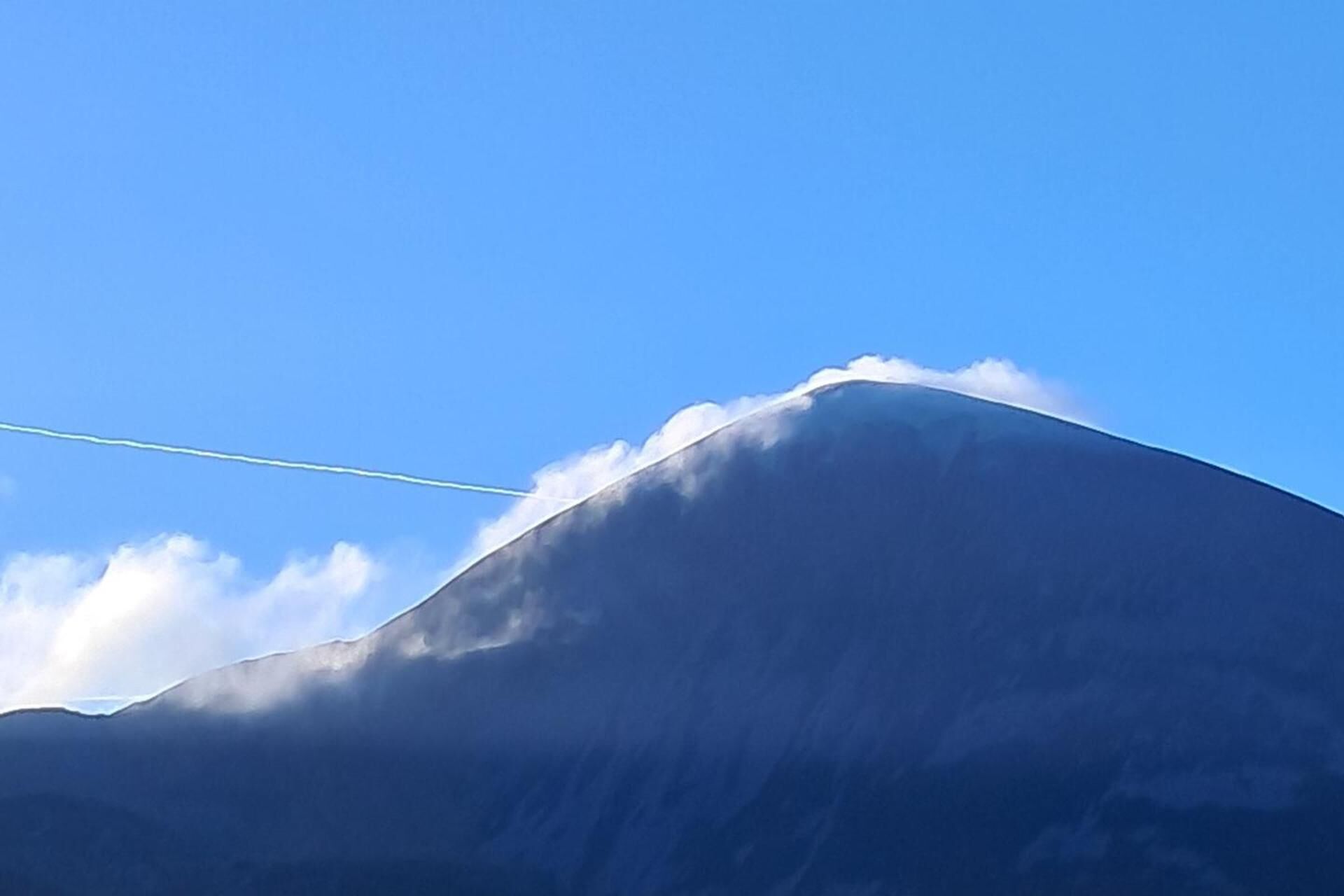 A mountain with a clear sky.
